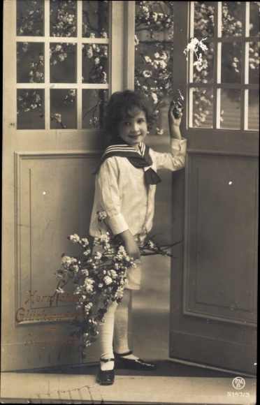 Happy name day! Child in sailor shirt with flowering branches