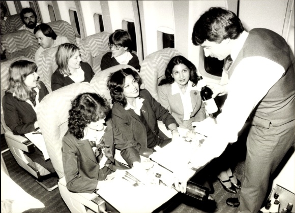 Photo of a passenger plane, interior view, flight attendant