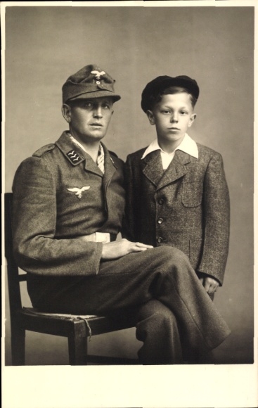 Photo of an air force officer in uniform, seated portrait, collar tabs, young