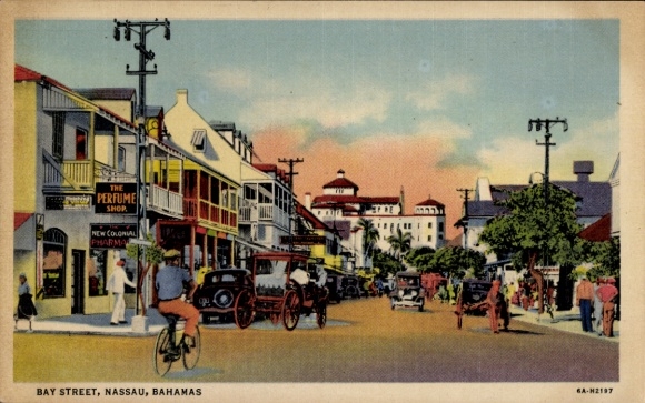 Postcard Nassau Bahamas, BAY STREET, shops, bicycles, old cars