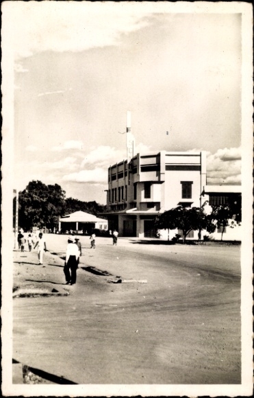 Postcard Bangui Central African Republic, townhouse, street, people, trees, clouds