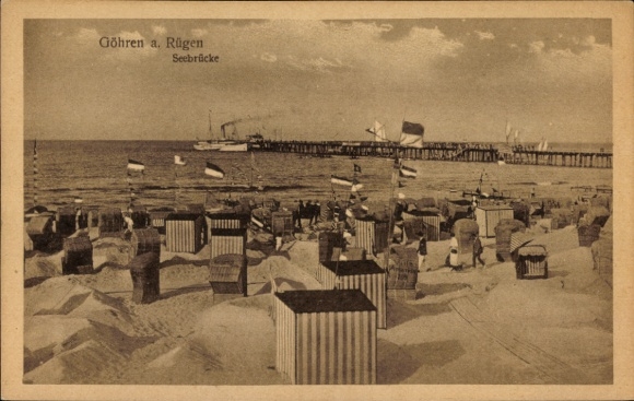 Göhren Baltic Sea resort on Rügen, beach with beach chairs, pier, ships, flags