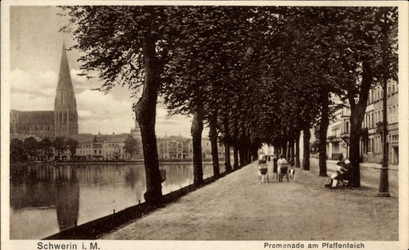 Schwerin in Mecklenburg, Schwerin i. M., Promenade am Pfaffenteich, trees, walkers, church