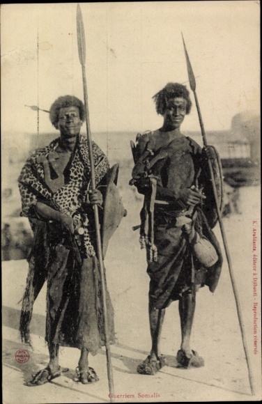 Postcard portrait Somali tribal warriors with spears