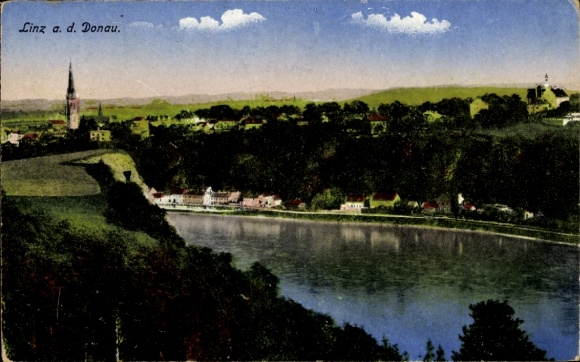 Linz on the Danube, Upper Austria, landscape with river, church, houses, hills, clouds