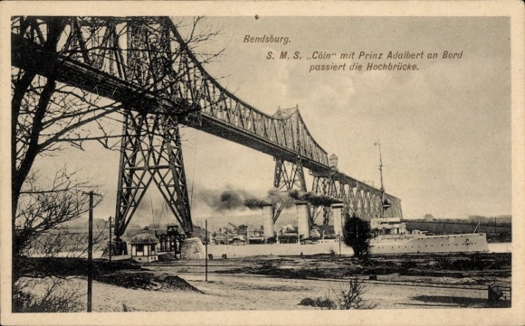 At Rendsburg in Schleswig-Holstein, SMS Cöln with Prince Adalbert on board passes under the high bridge