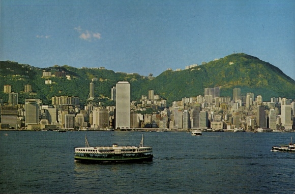 Postcard Hong Kong China, view of Hong Kong harbor, ferry, tall buildings, green hills