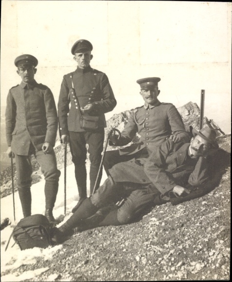 Photo of mountaineers on the summit of a mountain, German soldiers in uniform, hikers in civilian clothes