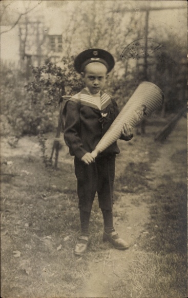 Photo Postcard boy in sailor shirt on the first day of school, standing portrait with candy cone