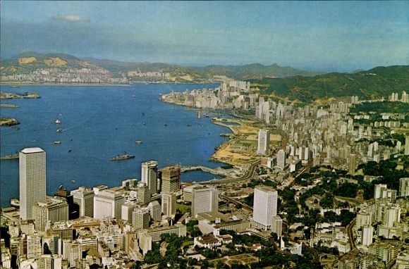 Postcard Hong Kong China, aerial view of harbor, modern buildings, mountains in the background