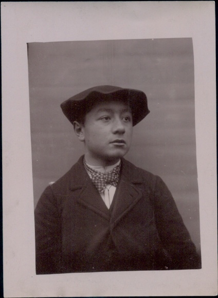 Photo portrait of a boy, hat, coat