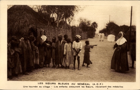 Postcard Senegal, A tour through the village, The children surround the sisters