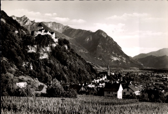Postcard Vaduz Liechtenstein, castle on a hill, mountains in the background, village with church