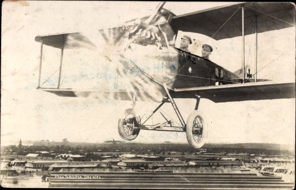 Photo Postcard military aircraft over a city, photomontage, pilots