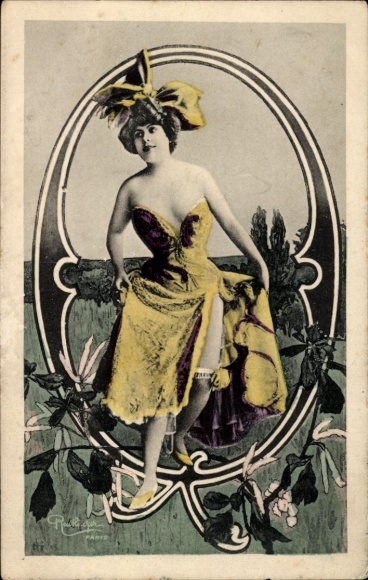 Letters Ak, letter O, woman in a yellow dress
