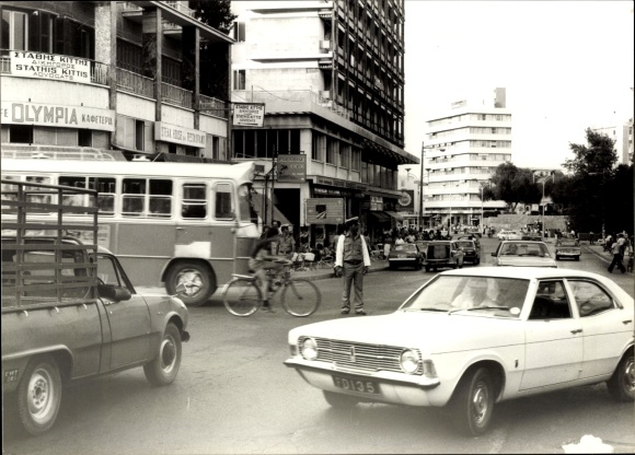 Photo Nicosia Cyprus, street, traffic, pedestrians, bus, Olympia shop