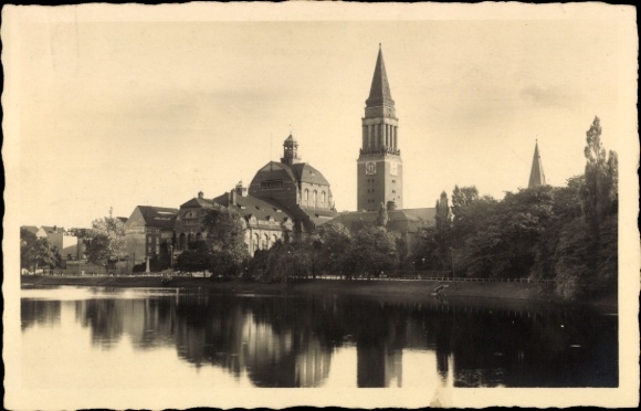 Photo by Postcard Kiel in Schleswig-Holstein, view from the water towards the town, water reflection, church tower