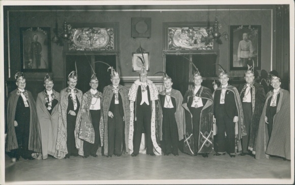 Photo of carnival, council of eleven, group photo in regalia, hall, imperial portraits on the wall